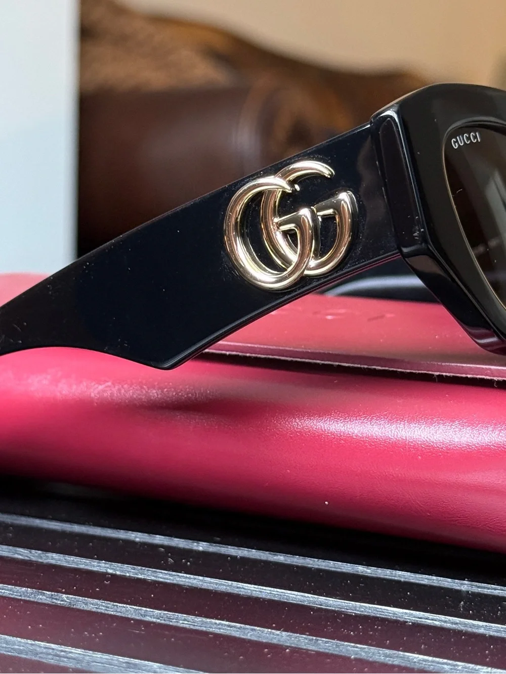 Gucci Black Oval Women's Sunglasses with Dark Lenses